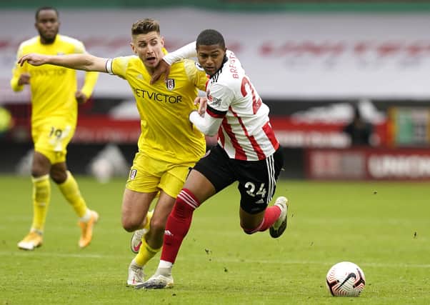 TESTING TIMES: Sheffield United's Rhian Brewster battles with Fulham's Tom Cairney during last week's stalemate at Bramall Lane. Picture: Andrew Yates/Sportimage