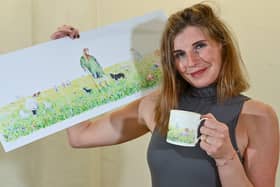 Amanda with Anita Bowerman's painting now printed onto a mug for sale via the farm's website