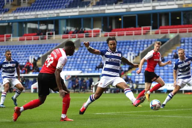 Rotherham United's Wes Harding (left) and Reading's Liam Moore play in front of empty stands (Picture: PA)