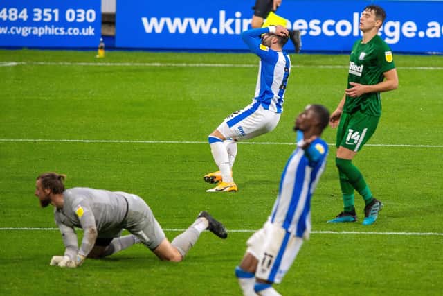 AGONY: Huddersfield Town's players show their frustration after Pipa's late shot goes wide of the Preston goal.  Picture: Bruce Rollinson