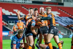 COMMITED: Castleford's Adam Milner is congratulated by team members on scoring a try against Hull KR last Thursday Picture by Allan McKenzie/SWpix.com