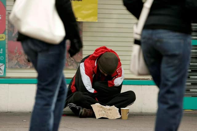 File pic: A beggar on the streets of a British city. SWNS