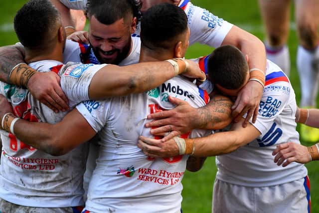 Wakefield Trinity players embrae after scoring a try, but are they putting their health at risk?