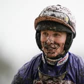 A mud-splattered Harry Cobden after partnering Cyrname to Grade One glory at Ascot.