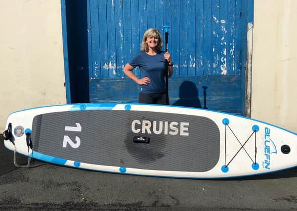 Jo Moseley, 55, stand-up paddleboarded across the UK