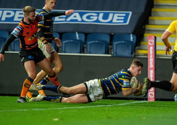 Stretching over: Liam Sutcliffe scores the Rhinos third try in the win over Castleford.  Picture Bruce Rollinson