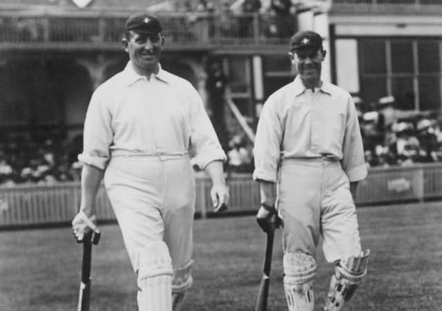 Striding out: Australian cricketers Warwick Armstrong (1879 - 1947), left, and Victor Trumper (1877 - 1915) going out to bat in the First Test against England at Birmingham, 27th  May 1909. (Photo by Topical Press Agency/Hulton Archive/Getty Images)