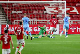 Middlesbrough's Britt Assombalonga (second right) scores his side's first goal against Coventry City. Picture: Richard Sellers/PA