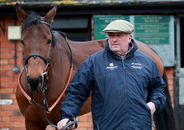 Trainer Paul Nicholls with Cyrname. Picture: Adam Davy/PA Wire.