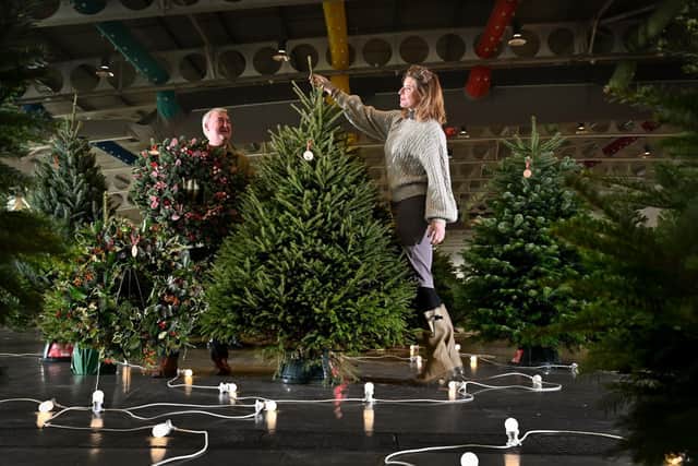 Peter Wright and Amanda Owen dressing a Christmas tree as special guest judges in the competition.