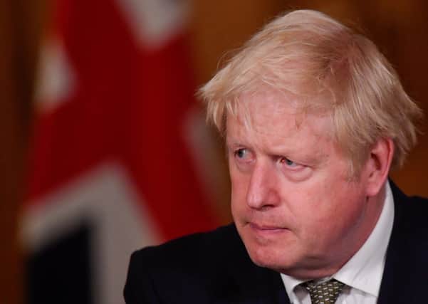 Prime Minister Boris Johnson has some tough decisions to make over coronavirus restrictions. Photo: Toby Melville/PA Wire