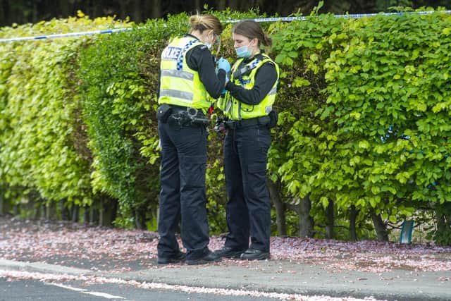 West Yorkshire Police officers at a crime scene in Leeds during the lockdown
