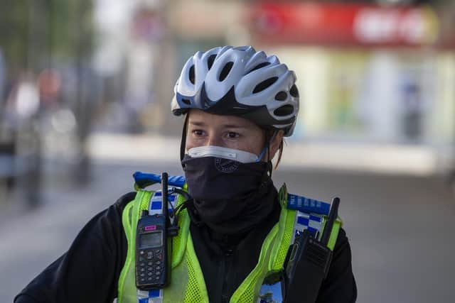 A South Yorkshire Police officer wears a mask while out on public duty in Doncaster during the lockdown