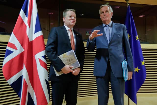 European Union chief Brexit negotiator Michel Barnier (R) and the British Prime Minister's Europe adviser David Frost speak at start of the first round of post-Brexit trade deal talks between the EU and the United Kingdom, back in March.  Photo: Olivier HOSLET / POOL / AFP via Getty Images