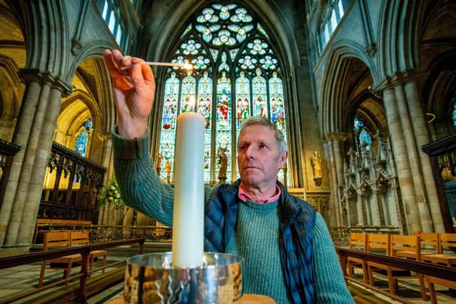 Tom Ramsden lights a candle at Ripon Cathedral in memory of his father, the Rt. Hon James Ramsden ahead of the service for the bereaved