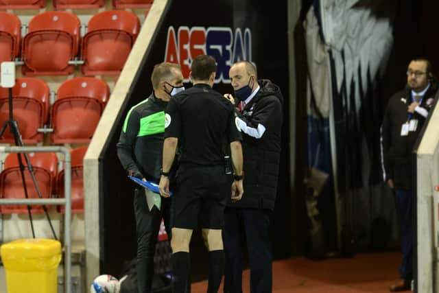 DISCUSSION: Referee Jarred Gillett talks to officials
