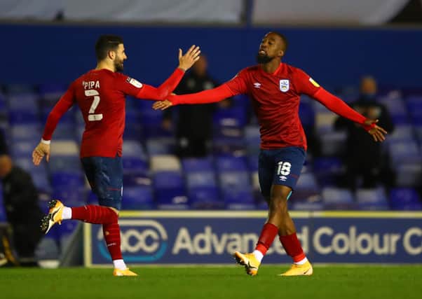 Huddersfield Town's Isaac Mbenza celebrates with team mate Pipa after scoring his side's equaliser at St Andrew's. Picture: Michael Steele/Getty Images