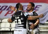 Hull FC's Bureta Faraimo celebrates his two tries against Hull KR with team-mate Mahe Fonua. Picture: Jonathan Gawthorpe/JPIMedia.