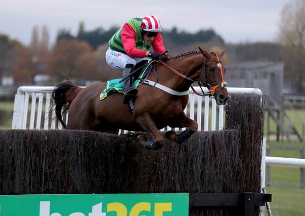 This was Definitly Red clearing the last to win the 2018 Charlie Hall Chase under Danny Cook.
