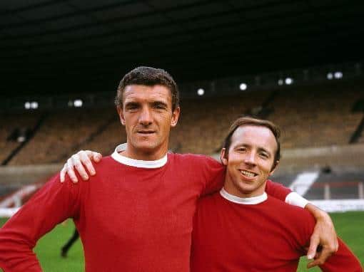 Bill Foulkes (left) and Nobby Stiles (right) playing for Manchester United