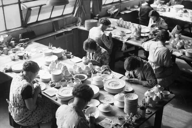 June 1936:  Workers glazing stoneware at the Wedgwood pottery.  (Photo by Fox Photos/Getty Images)