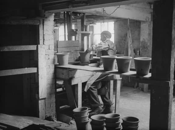 23rd April 1935:  Throwing a pot in the centuries old pottery at Ewenny, near Bridgend in south Wales owned by David J Jenkins.  (Photo by Fox Photos/Getty Images)