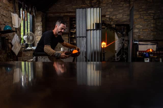 Stephen is a glassmaker and blows all the forms in hot glass. Picture: James Hardisty