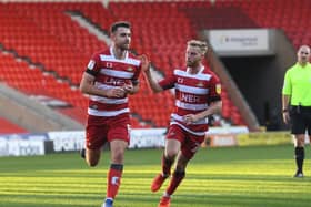 Doncaster's Ben Whiteman celebartes his goal with Josh Sims. Picture: Howard Roe