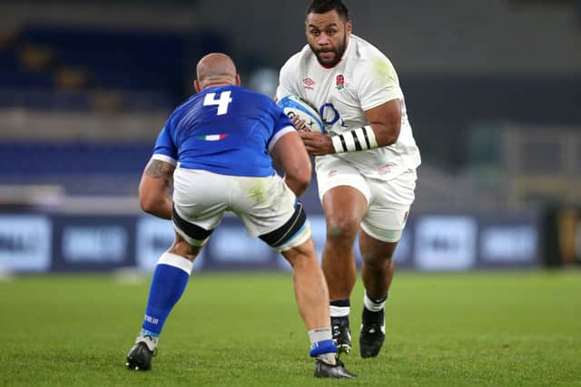 Driving force: England's Billy Vunipola (right) runs at Italy's Marco Lazzaroni. Picture: Marco Lacobucci/PA Wire.
