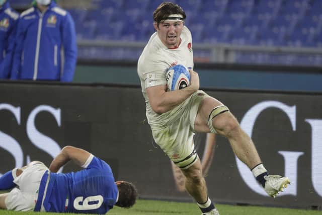 Striding through: England's Tom Curry runs over the line to score a try during the win over Italy. Picture: AP Photo/Gregorio Borgia.