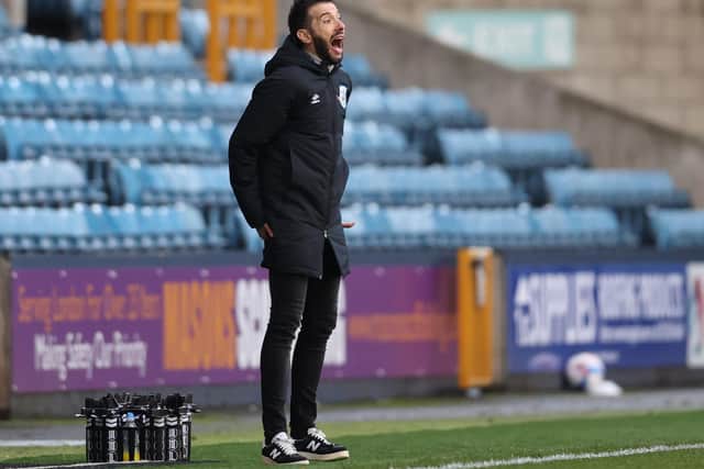 Carlos Corberan watches on from the sideline at The Den.