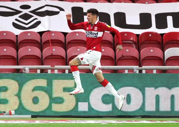 Jumping for joy: Middlesbrough's Marvin Johnson celebrates scoring at the Riverside Stadium. Picture: PA
