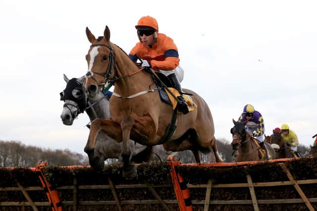 Sam Spinner and Joe Colliver winning a handicap hurdle at Haydock on Betfair Chase day in November 2017.