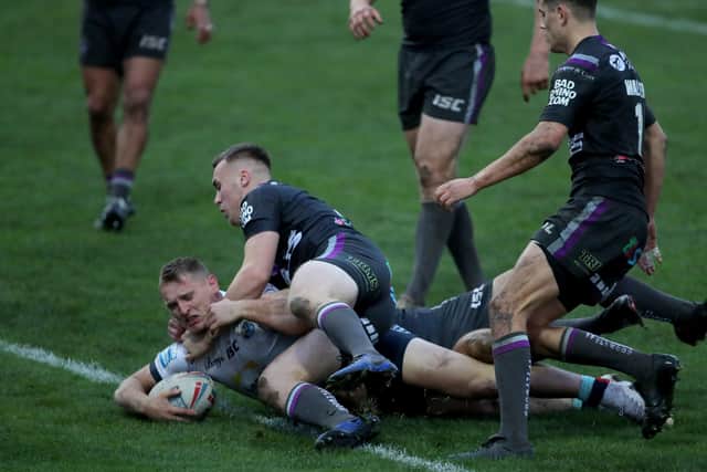 Winning score: Leeds Rhinos' Brad Dwyer (left) score what proved to be the winnign try against Wakefield Trinity. Picture: Richard Sellers/PA Wire.