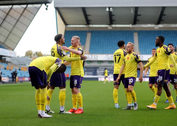 Huddersfield's Josh Koroma celebrates with Lewis O'Brien after scoring his team's first goal against Millwall at The Den. Picture: James Chance/Getty Images