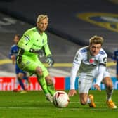 NOT TONIGHT: Patrick Bamford falls after a challenge from former Leeds goalkeeper Kasper Schmeichel during Monday night's 4-1 defeat to Leicester City at Elland Road.  Picture: Bruce Rollinson