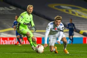 NOT TONIGHT: Patrick Bamford falls after a challenge from former Leeds goalkeeper Kasper Schmeichel during Monday night's 4-1 defeat to Leicester City at Elland Road.  Picture: Bruce Rollinson