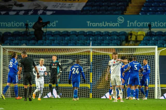 Liam Cooper, right, shows his disappointment as Leicester celebrate their fourth goal, scored from the penalty spot by Youri Tielemans. Picture: Bruce Rollinson.