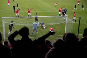 SUSPENDED: Action from Scarborough Athletic's Northern Premier League game at FC United. Athletic's season will go on hold this week, but United will be allowed to play Doncaster Rovers in the FA Cup on Saturday