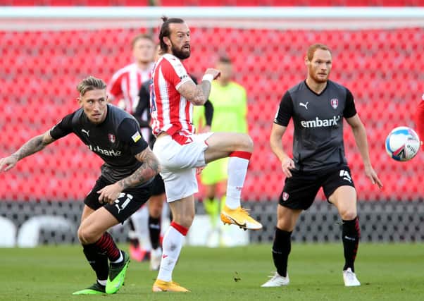 Another one gets away: Rotherham United's Angus MacDonald  and Stoke City's Steven Fletcher battle for the ball in a game the Millers now believe they should have won. Picture: Barrington Coombs/PA