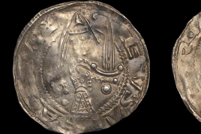 The 12-century coin.