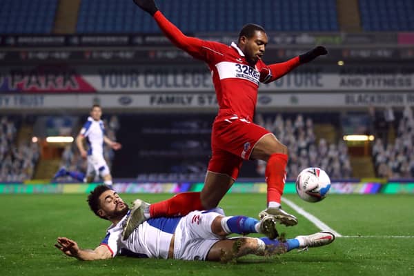 Middlesbrough's Britt Assombalonga (right) and Blackburn Rovers' Derrick Williams battle for the ball.