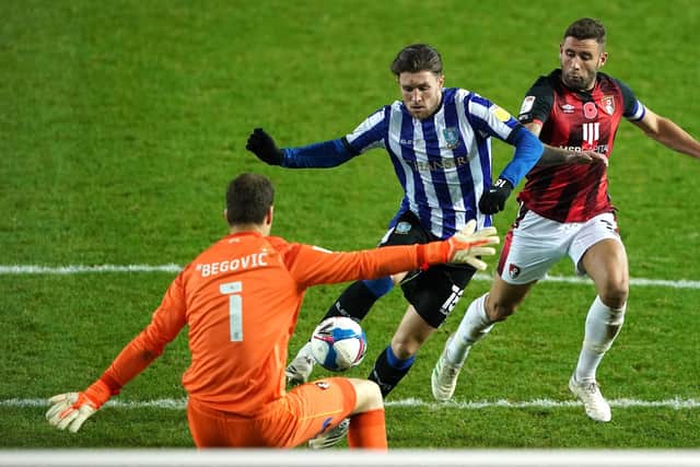 Sheffield Wednesday's Josh Windass (centre) is fouled by AFC Bournemouth's Steve Cook (right) which saw the Owls awarded a penalty and Cook sent off. Picture Zac Goodwin/PA