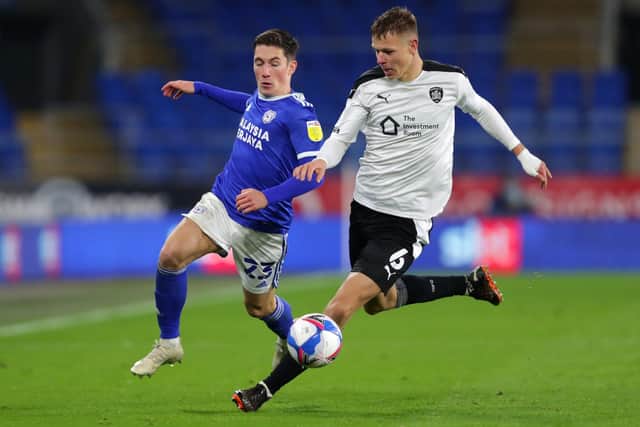 Cardiff City's Harry Wilson (left) and Barnsley's Mads Andersen battle for the ball at the Cardiff City Stadium. Picture: David Davies/PA