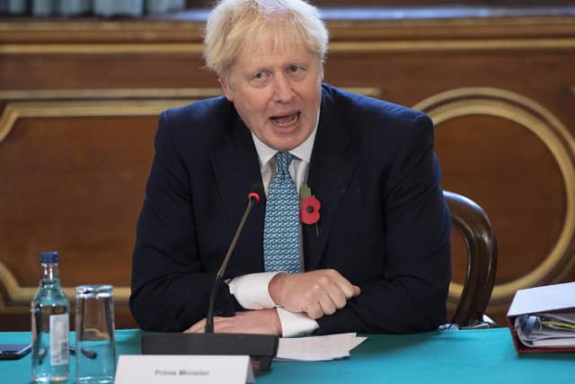 Boris Johnson at this week's Cabinet meeting - his handling of the second lockdown, which comes into effect today, has been called into question.