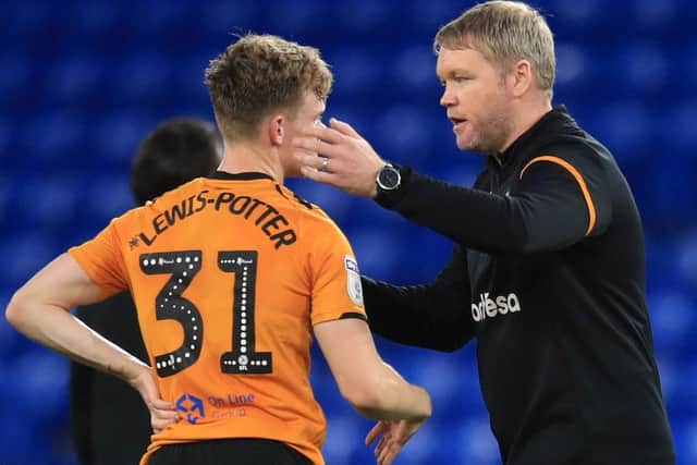 Grant McCann consoles Keane Lewis-Potter following Hull City's relegation from the Championship at the end of 2019/20.