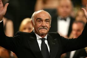 Sean Connery waves to the audience during the 34th AFI Life Achievement Award tribute to Sir Sean Connery held at the Kodak Theatre on June 8, 2006 in Hollywood, California.  (Photo by Kevin Winter/Getty Images for AFI)