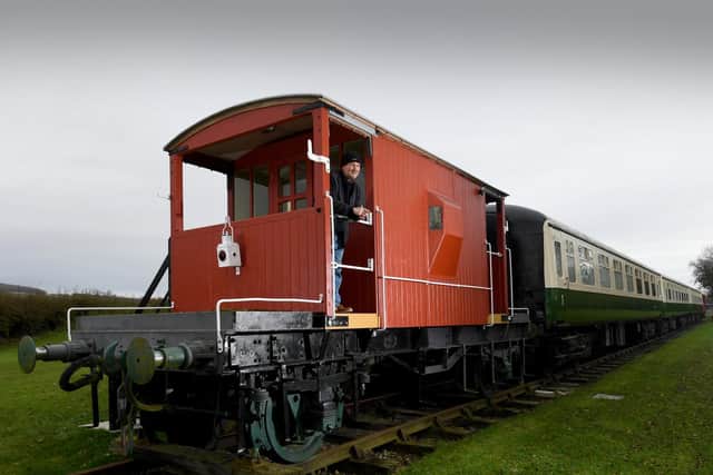 What was a derelict brake van has been restored and is now for the use of holiday makers. Mark is pictured with the van