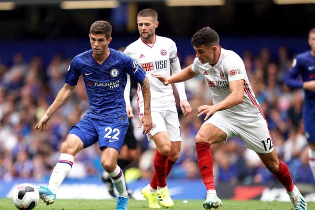 HELLO AGAIN: Chelsea's Christian Pulisic (left) and Sheffield United's John Egan battle for the ball during last season's Premier League clash between the two at Stamford Bridge. Picture: John Walton/PA