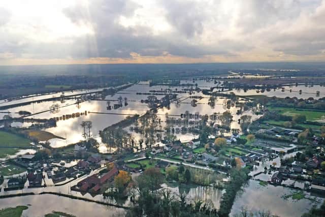 The flood water at Fishlake, in Doncaster, South Yorkshire, as parts of England endured a month's worth of rain in 24 hours, with scores of people rescued or forced to evacuate their homes. PA Photo. Picture date: Wednesday November 13, 2019